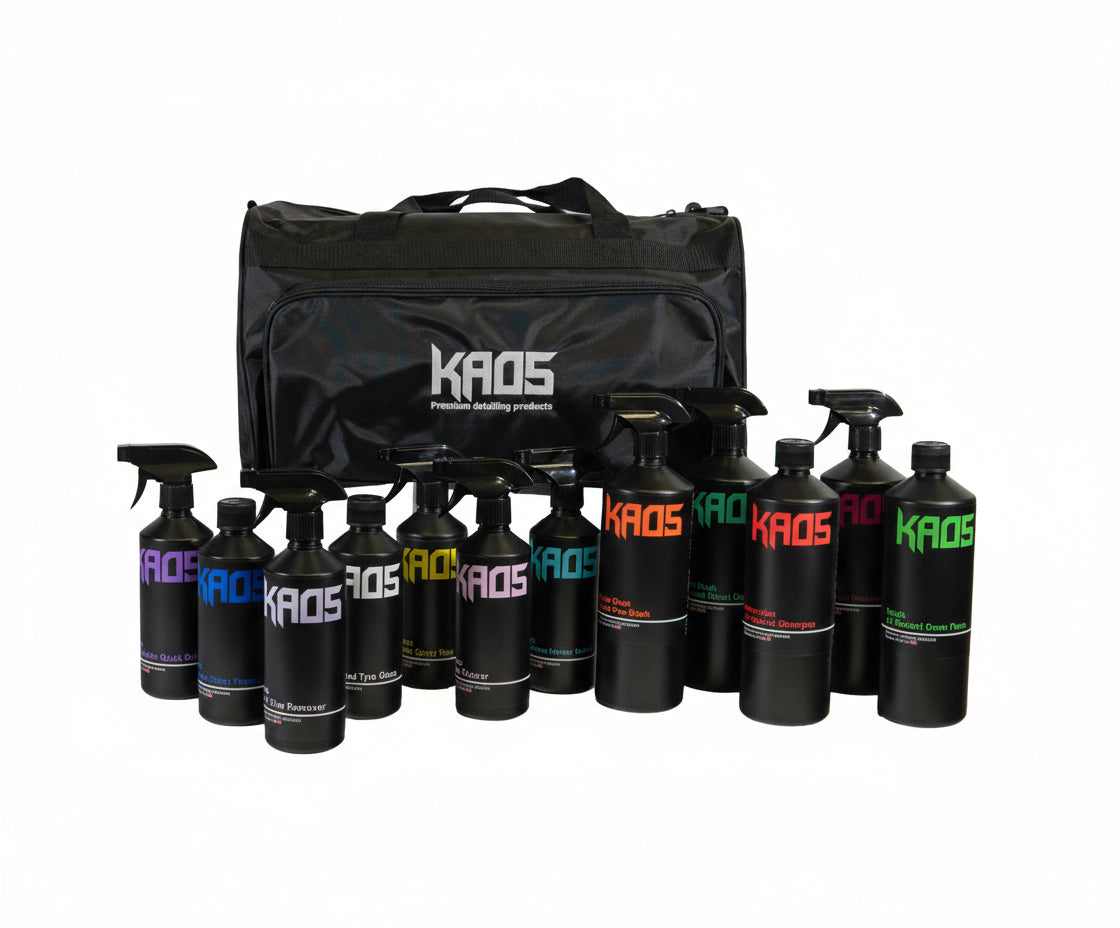 Set of KAOS automotive products including bottles and a black carrying bag on a white background